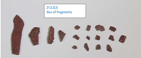 Inlays from shrine: two legs and box of fragments, Glass