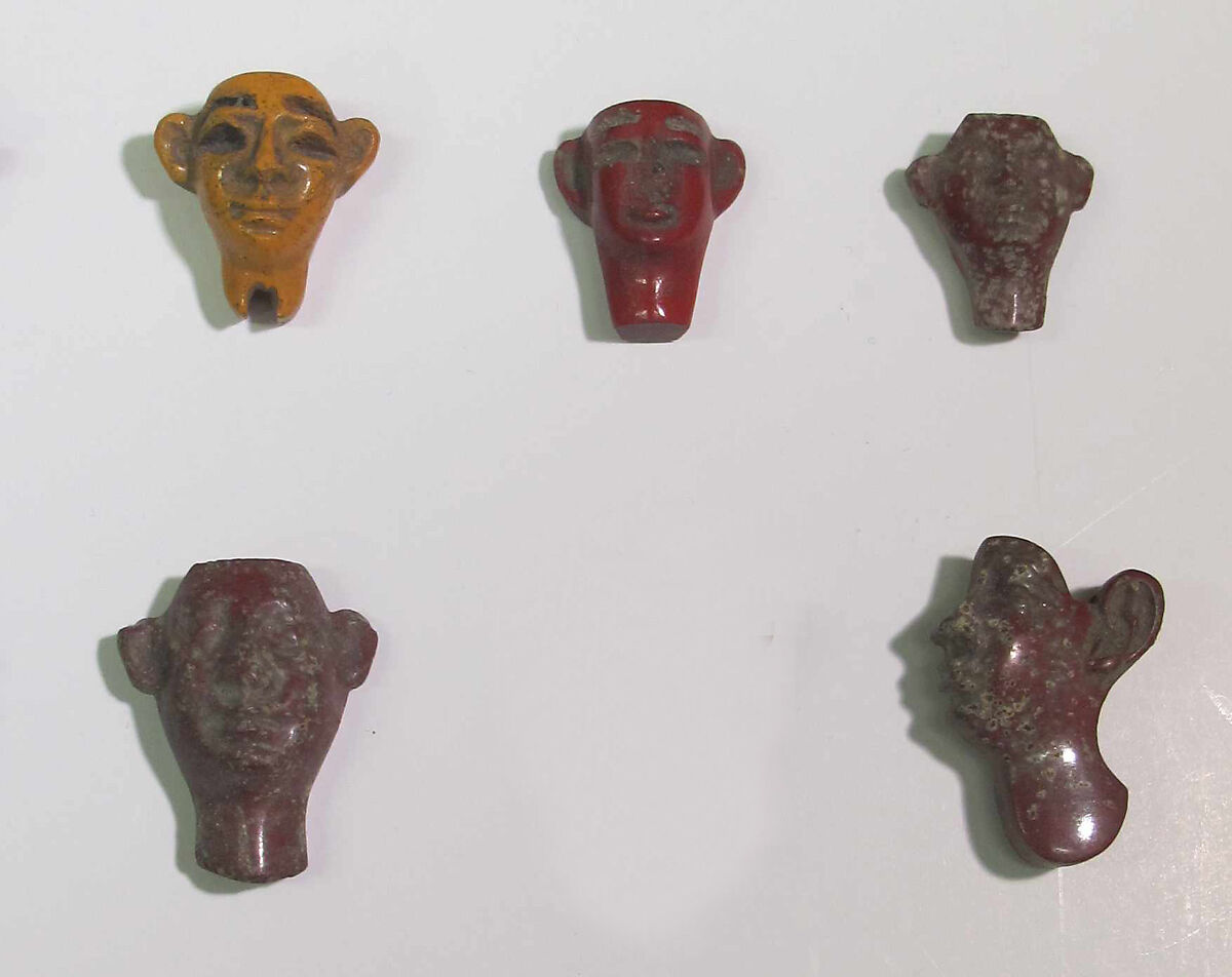 Inlays from shrine: heads, Glass 