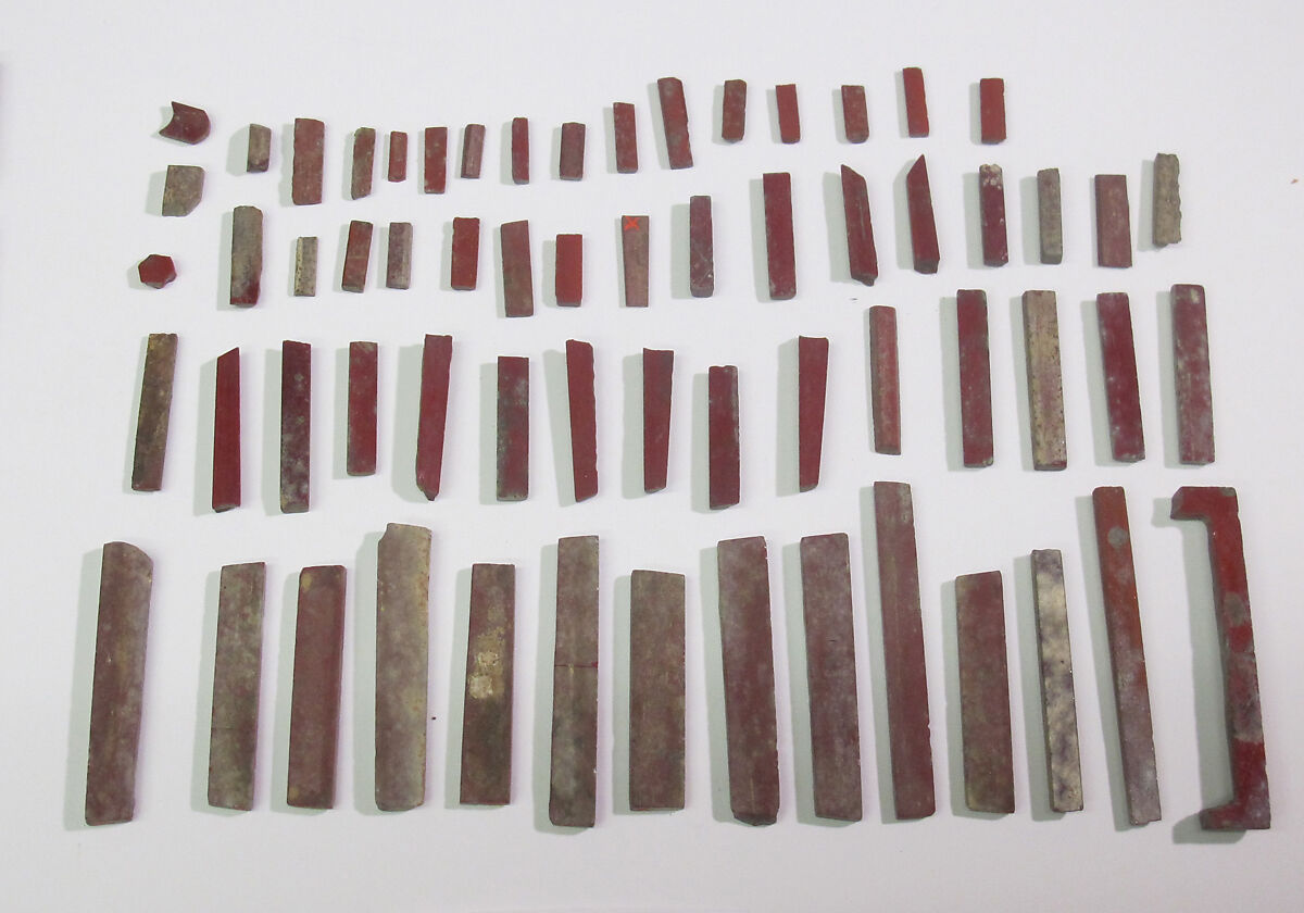 Inlays from shrine: box of red bars, Glass 