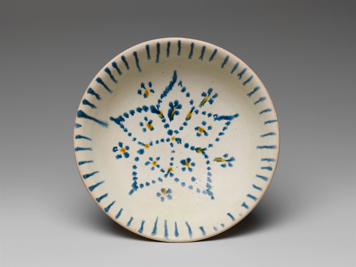 Bowl with five petaled flower, Earthenware with painted decoration and clear glaze, China 