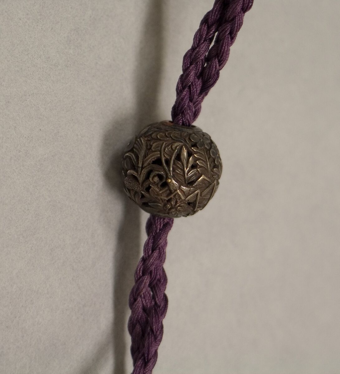 Ojime, Pierced metal with floral design, Japan