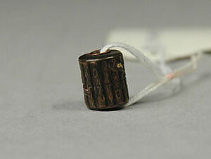 Ojime, Metal with plum blossoms in gold inlay, Japan