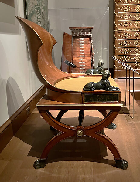 Sphinx Chair, Mahogany, with painted simulated marble panels, lacquered brass mouldings, mounted with bronze sphinxes and paw feet, French