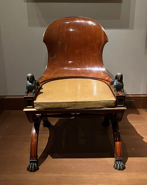 Sphinx Chair, Mahogany, with painted simulated marble panels, lacquered brass mouldings, mounted with bronze sphinxes and paw feet, French