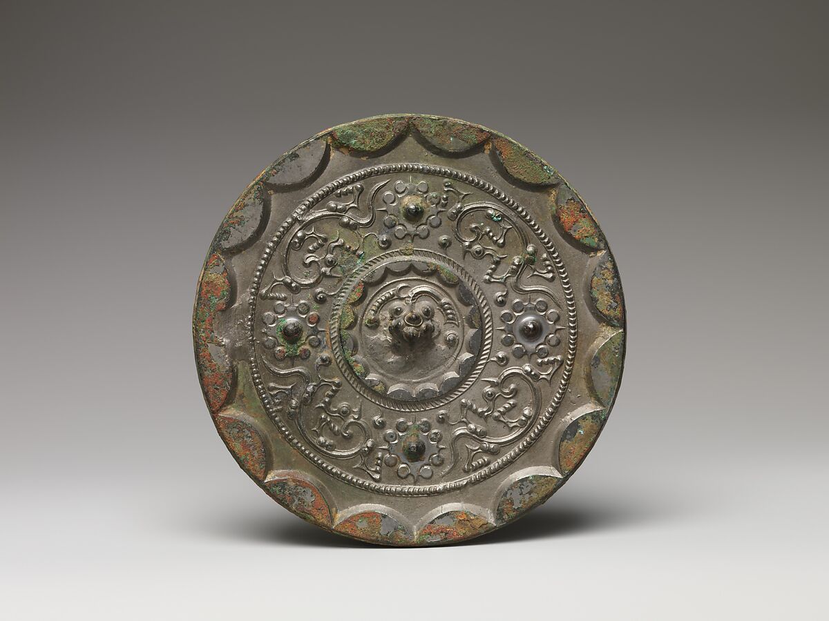 Mirror with dragons and knob-and-swirl design, Bronze, China 