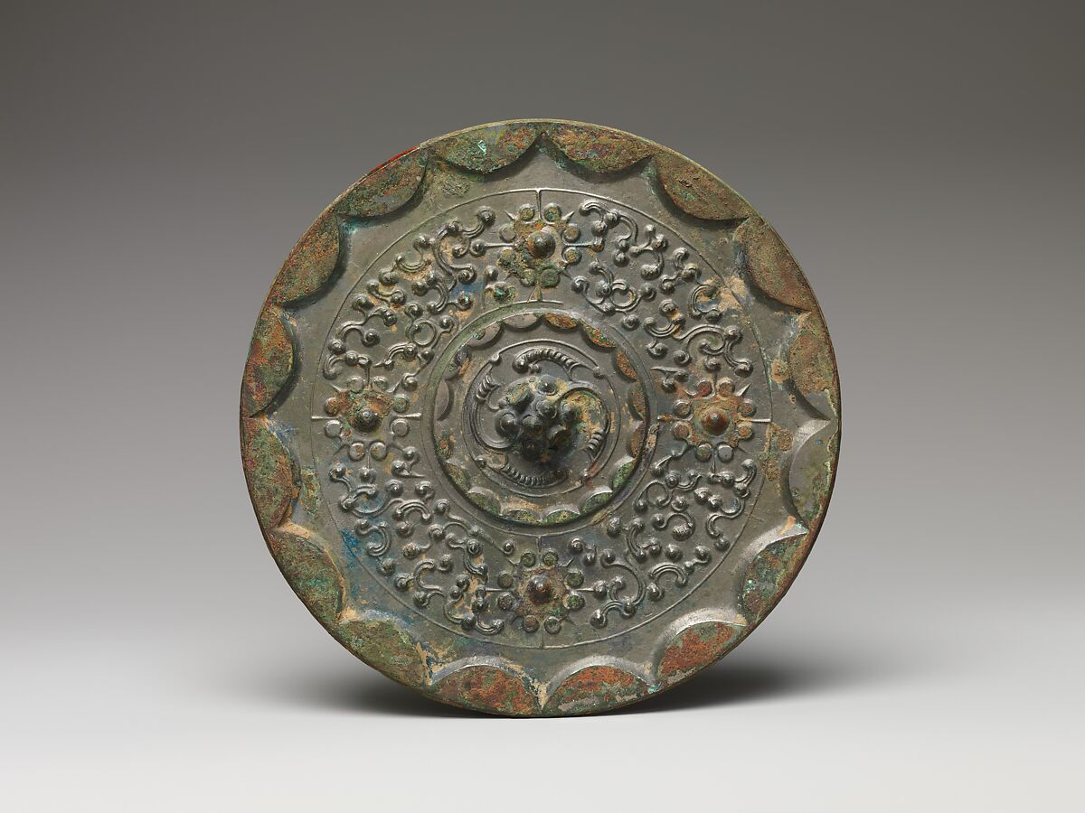 Mirror with dragons and knob-and-swirl design, Bronze, China 