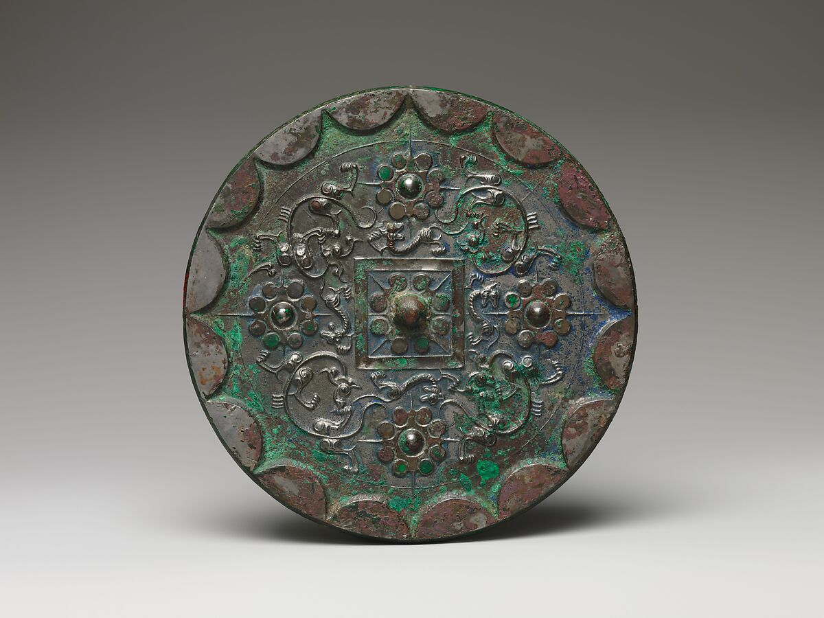 Mirror with dragons and knob-and-swirl design, Bronze, China 