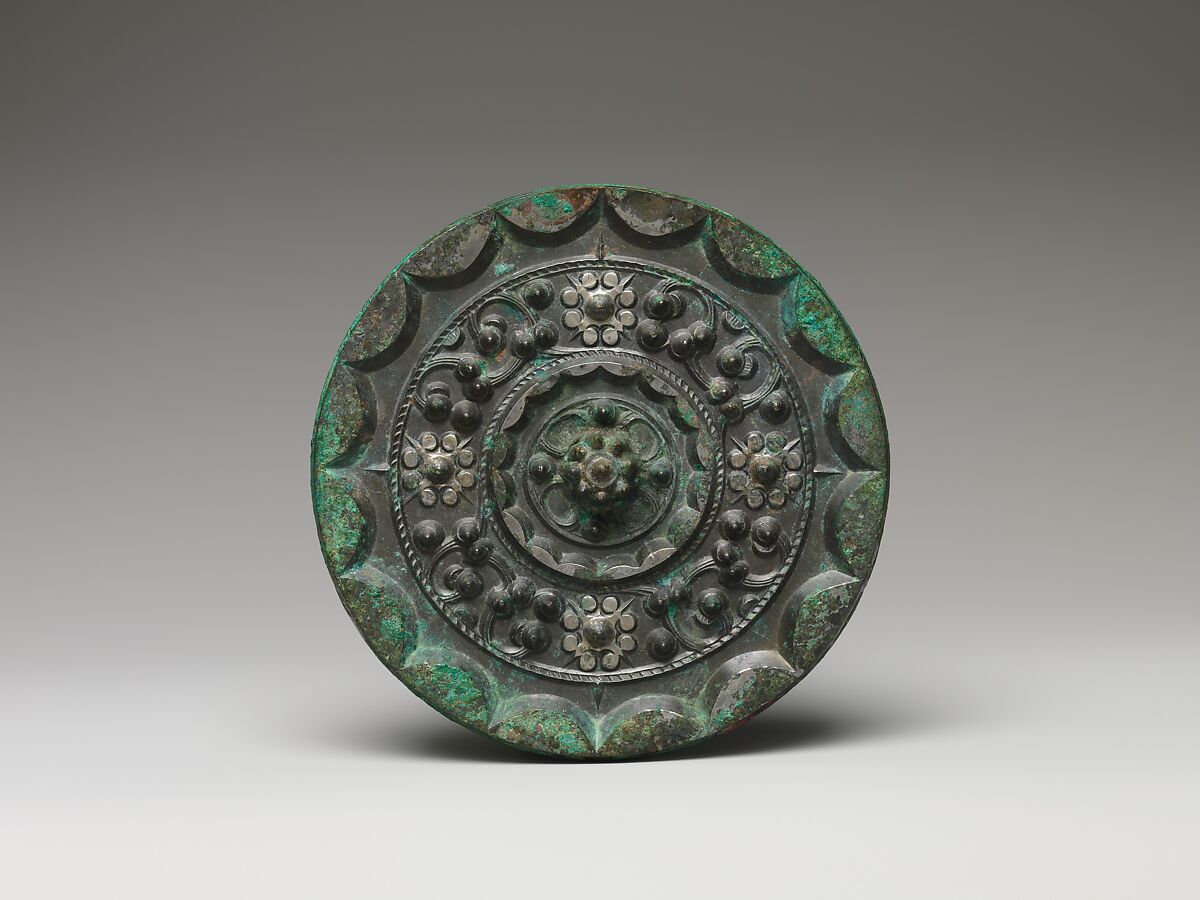 Mirror with dragons and knob-and-swirl design, Bronze, China 