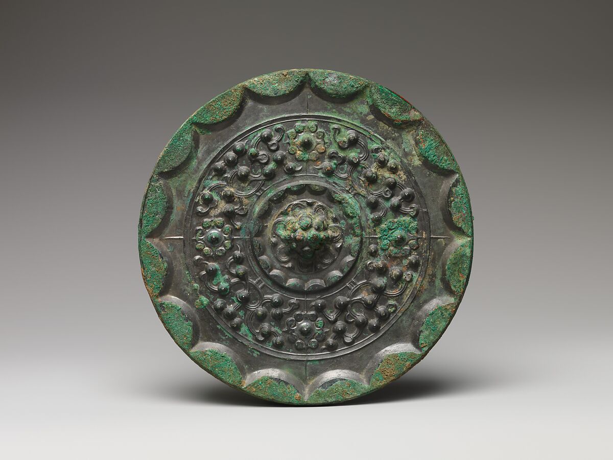 Mirror with dragons and knob-and-swirl design, Bronze, China 