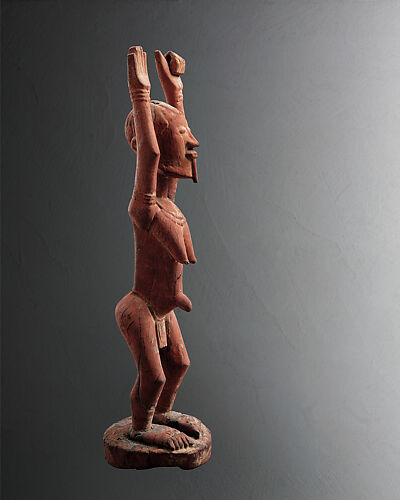 Figure with Raised Arms