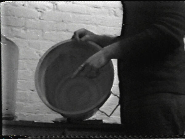 Mixing Bucket, William Wegman (American, born 1943), Single-channel digital video, transferred from Sony AV 3600 1/2-inch video tape, black-and-white, sound, 11 sec. 