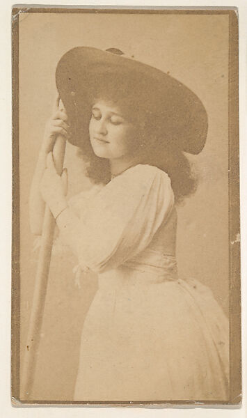 [Actress with dark hat and light dress holding pole], from the Actors and Actresses series (N150b) issued by Duke Sons & Co. to promote Duke Cigarettes, Issued by W. Duke, Sons &amp; Co. (New York and Durham, N.C.), Albumen photograph 