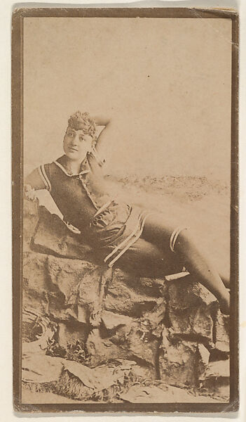 [Actress in bathing costume reclining on rocks], from the Actors and Actresses series (N150b) issued by Duke Sons & Co. to promote Duke Cigarettes, Issued by W. Duke, Sons &amp; Co. (New York and Durham, N.C.), Albumen photograph 