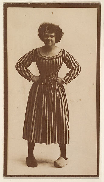 [Actress in striped dress with clogs], from the Actors and Actresses series (N150b) issued by Duke Sons & Co. to promote Duke Cigarettes, Issued by W. Duke, Sons &amp; Co. (New York and Durham, N.C.), Albumen photograph 