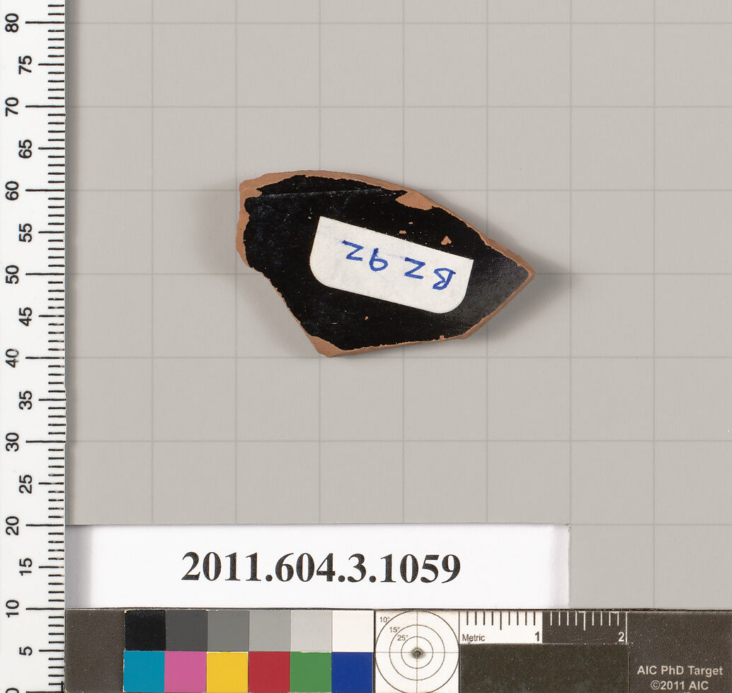 Terracotta fragment of a mastoid (drinking cup with narrow base), Terracotta, Greek, Attic