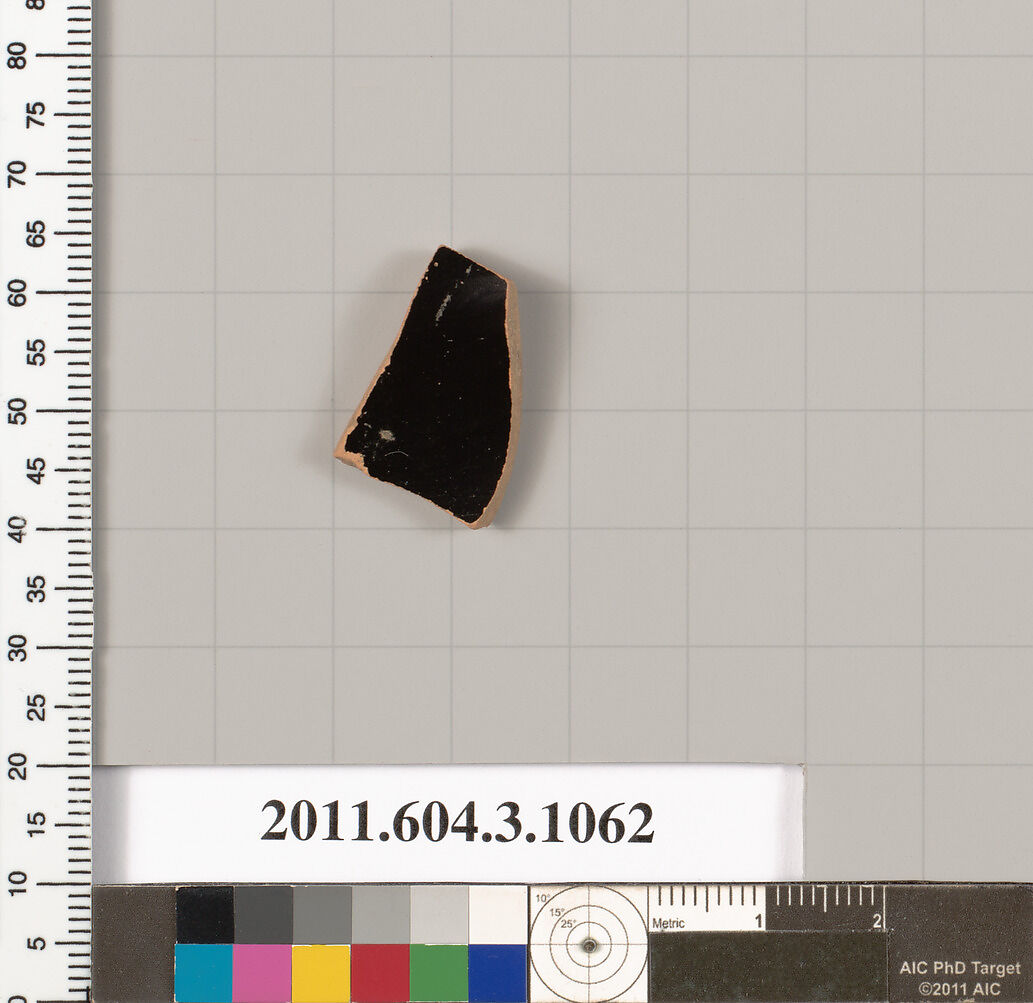 Terracotta fragment of a mastoid (drinking cup with narrow base), Terracotta, Greek, Attic