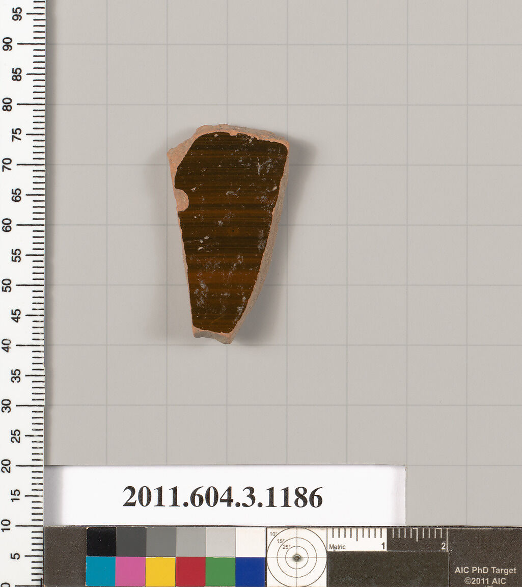 Terracotta fragment of a mastoid (drinking cup with narrow base), Terracotta, Greek, Attic
