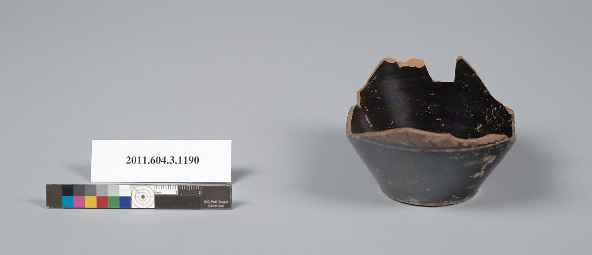 Terracotta fragment of a mastoid (drinking cup with narrow base), Terracotta, Greek, Attic