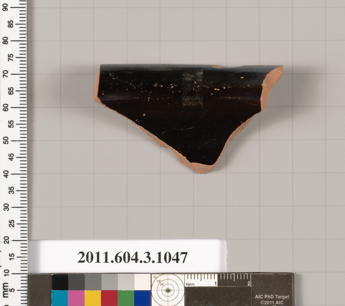 Terracotta fragment of a mastoid (drinking cup with narrow base), Terracotta, Greek, Attic