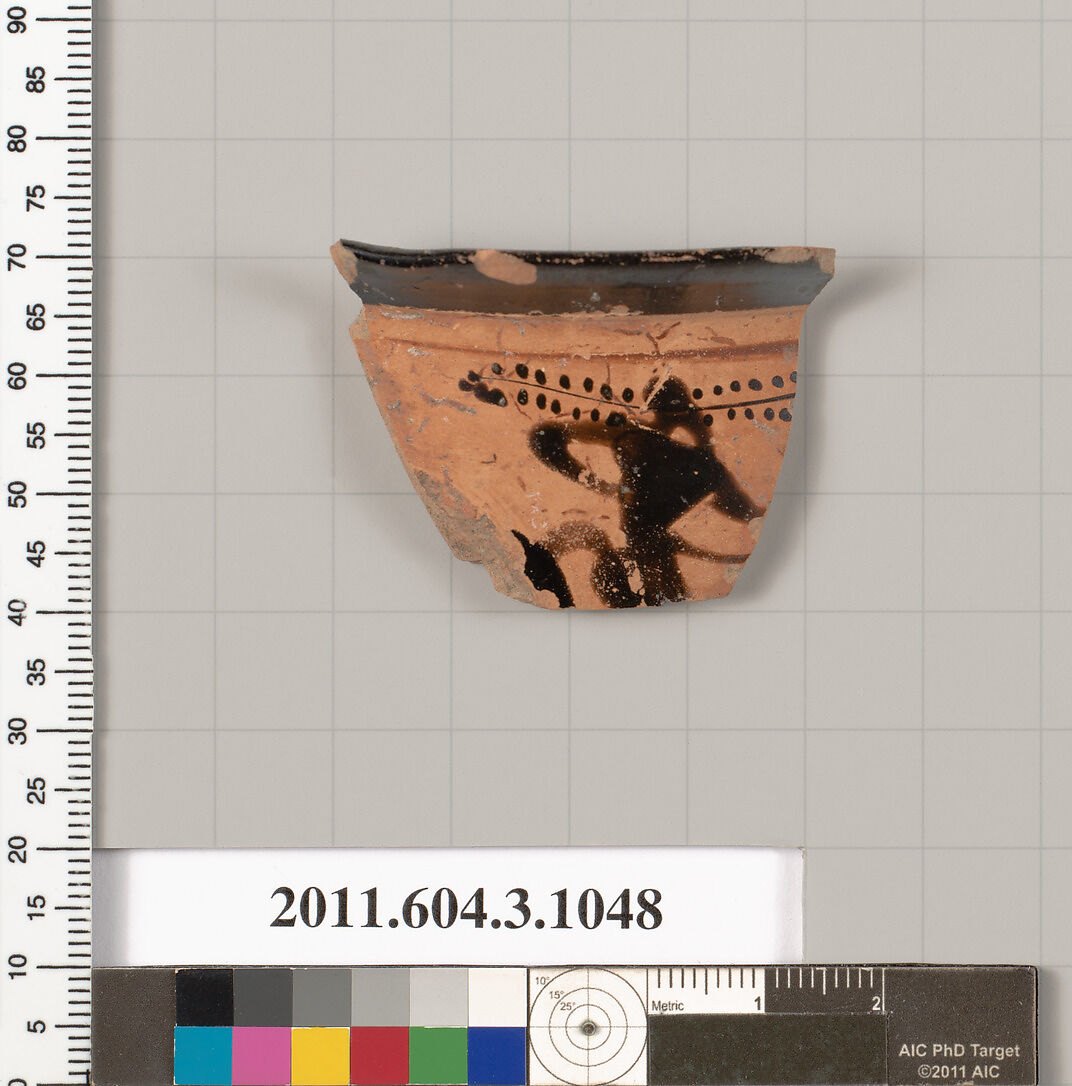 Terracotta fragment of a mastoid (drinking cup with narrow base), Terracotta, Greek, Attic