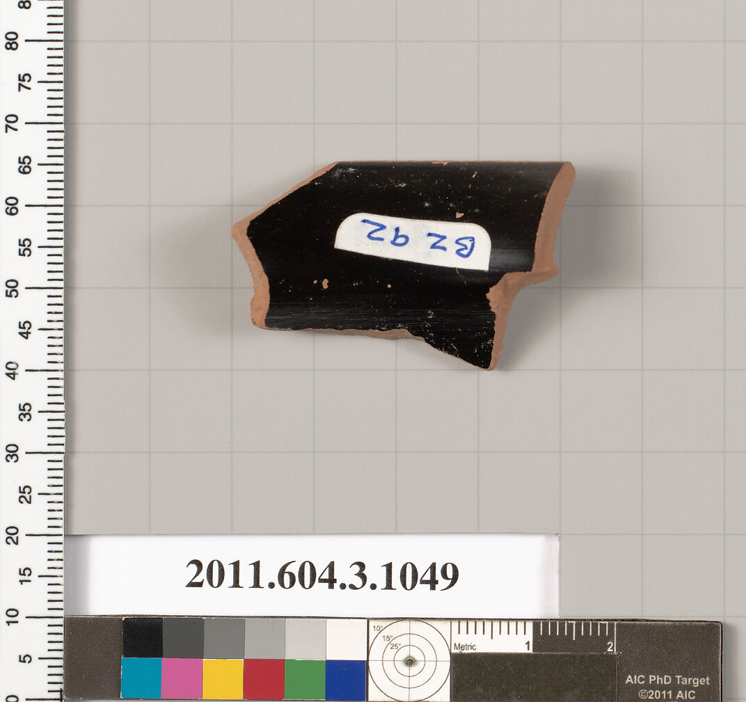 Terracotta fragment of a mastoid (drinking cup with narrow base), Terracotta, Greek, Attic