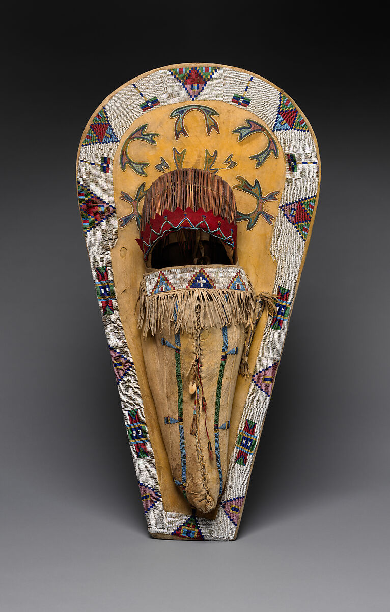 Cradleboard, Wood, tanned leather, pigment, glass beads, wool cloth, metal cones, feathers, and bone, Ute, Native American 