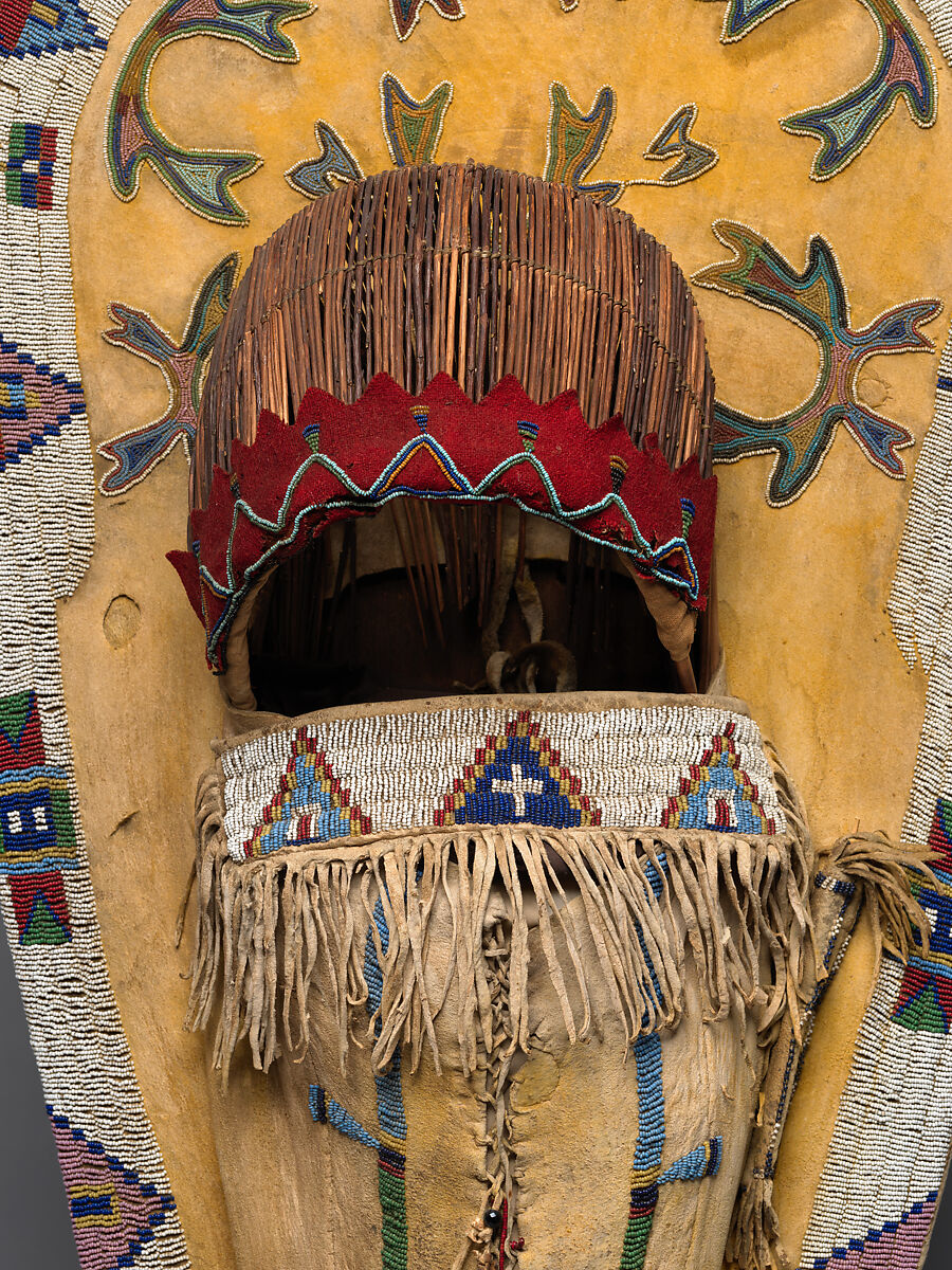 Cradleboard, Wood, tanned leather, pigment, glass beads, wool cloth, metal cones, feathers, and bone, Ute, Native American