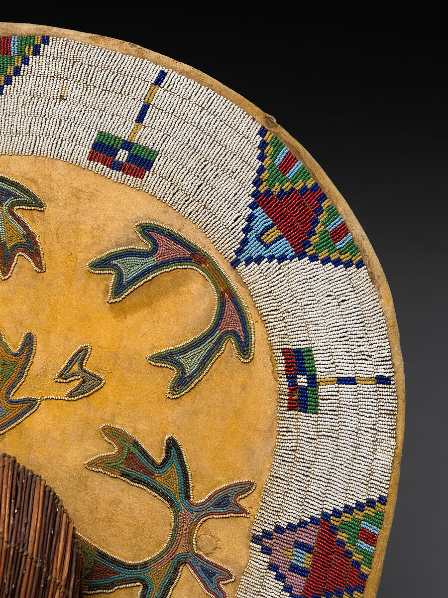 Cradleboard, Wood, tanned leather, pigment, glass beads, wool cloth, metal cones, feathers, and bone, Ute, Native American