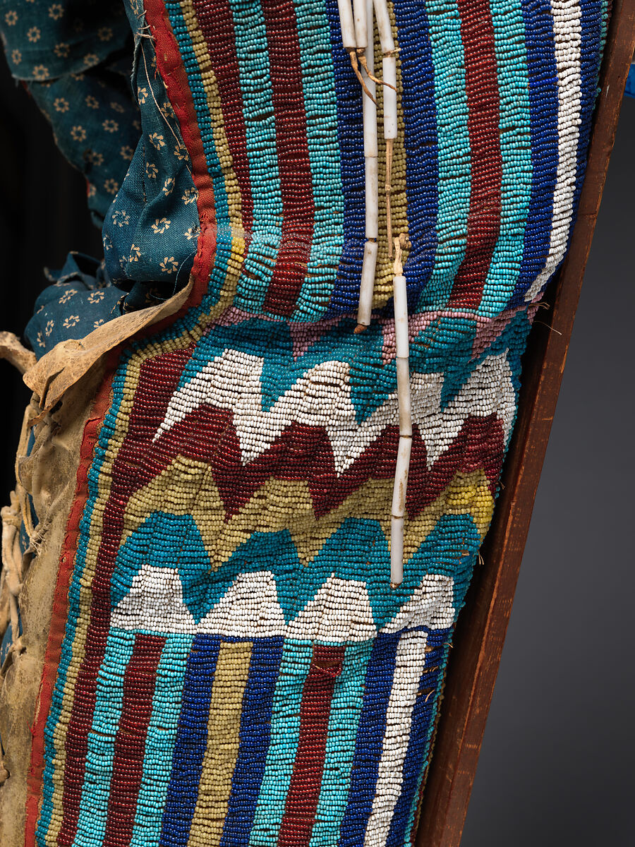 Cradleboard, Tanned leather, rawhide, wood, pigment, glass beads, wool cloth, cotton cloth, brass tacks, and brass link chain, Kiowa, Native American