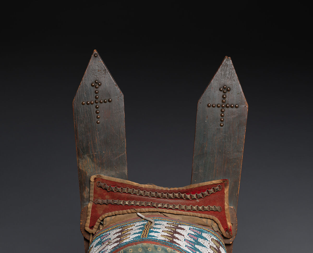 Cradleboard, Tanned leather, rawhide, wood, pigment, glass beads, wool cloth, cotton cloth, brass tacks, and brass link chain, Kiowa, Native American