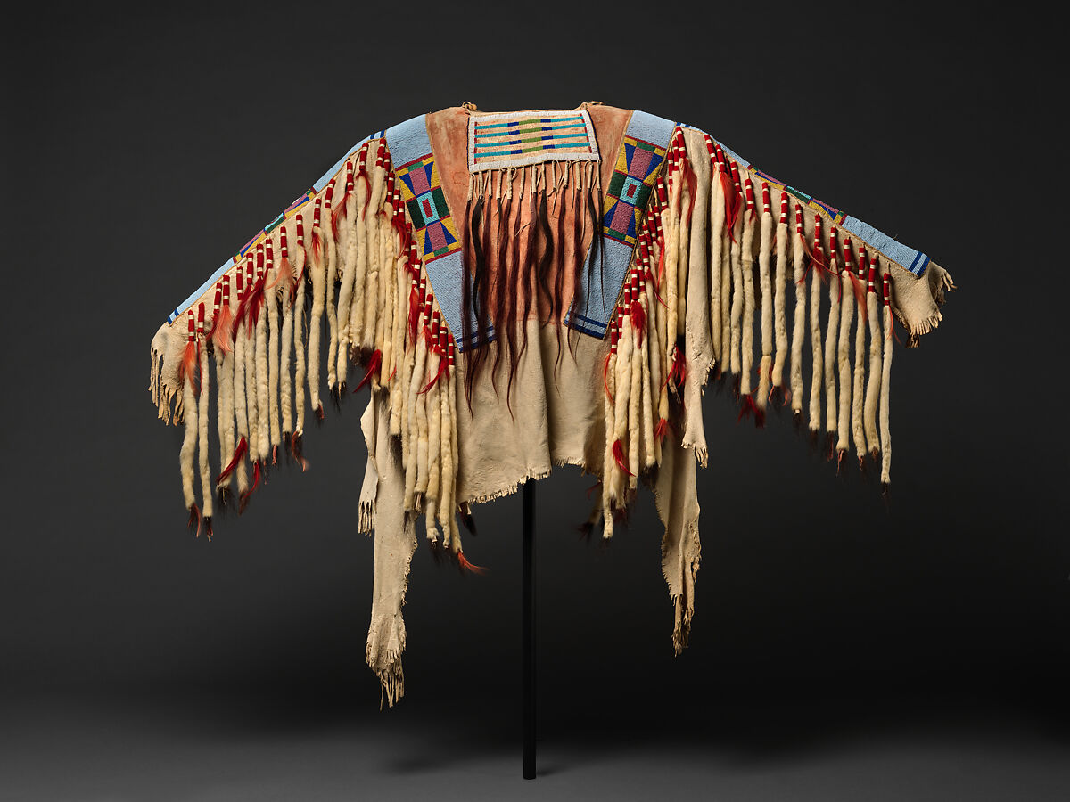 War shirt, Tanned leather, glass beads, pigment, wool cloth, ermine, human hair, and feathers, Crow, Native American