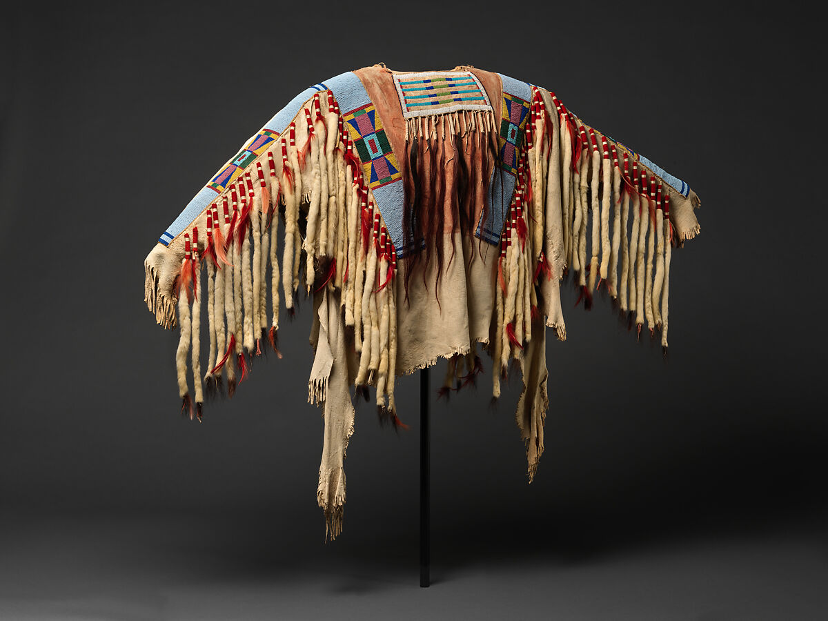War shirt, Tanned leather, glass beads, pigment, wool cloth, ermine, human hair, and feathers, Crow, Native American