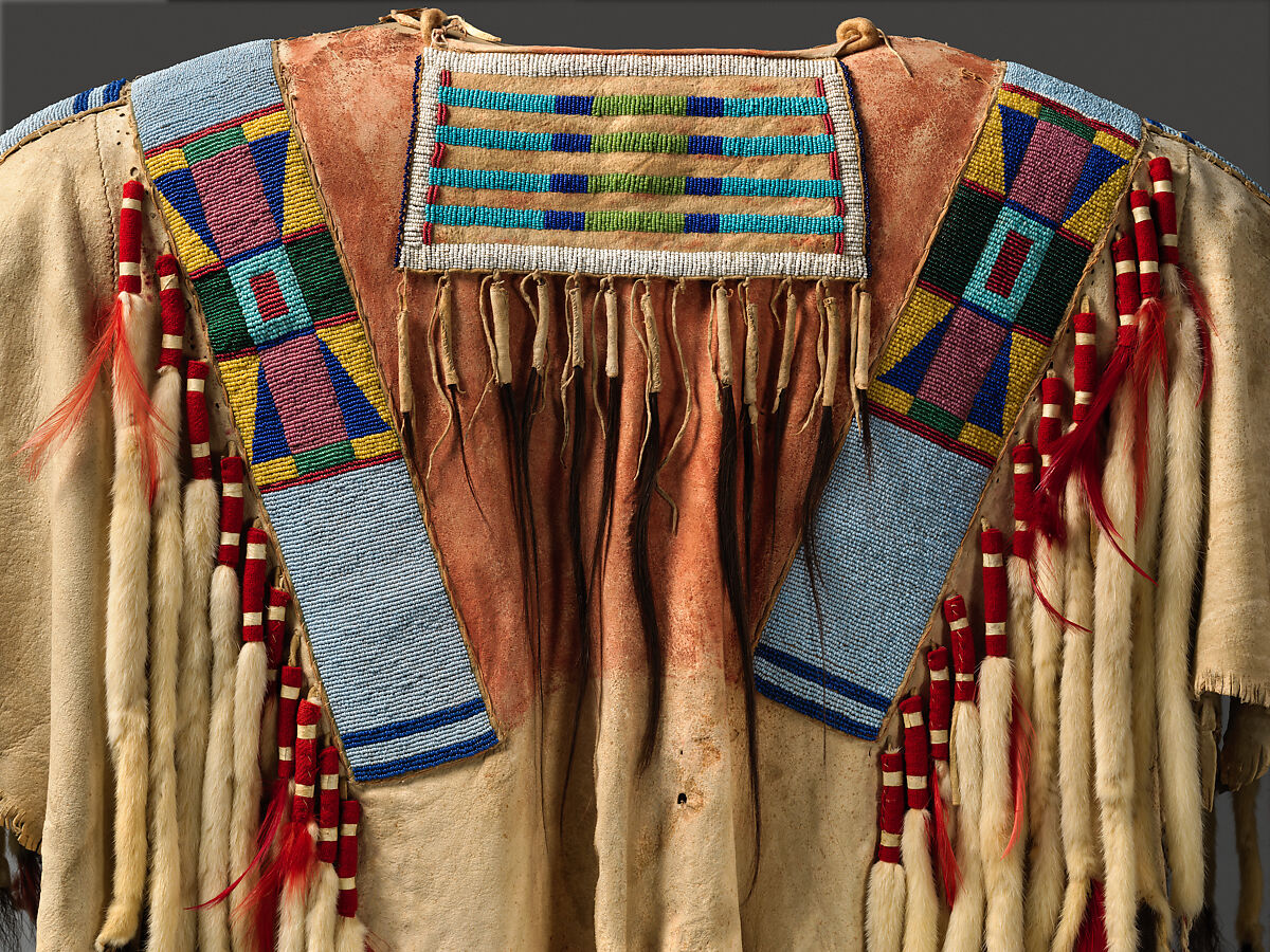 War shirt, Tanned leather, glass beads, pigment, wool cloth, ermine, human hair, and feathers, Crow, Native American