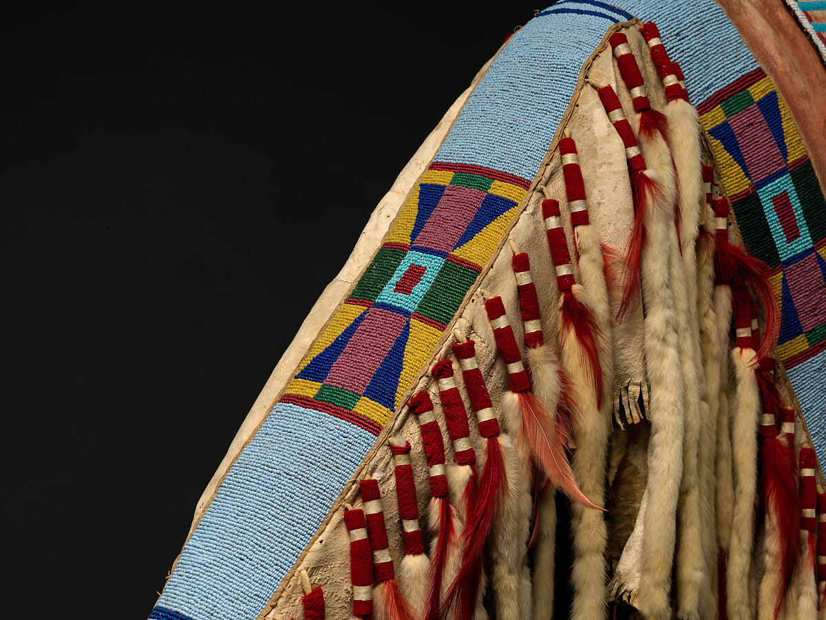 War shirt, Tanned leather, glass beads, pigment, wool cloth, ermine, human hair, and feathers, Crow, Native American