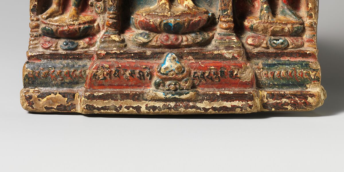 Buddha flanked by Avalokiteshvara-Padmapani and Vajrapani, Fired clay, molded and polychromed , Tibet