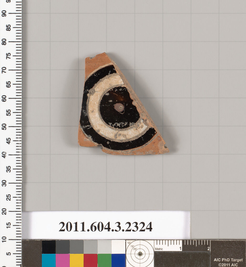 Terracotta fragment of a kylix: eye-cup (drinking cup), Terracotta, Greek, Attic 