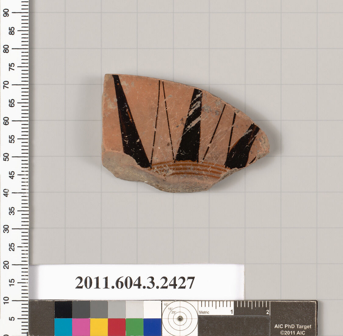 Terracotta fragment of a kylix: eye-cup (drinking cup), Terracotta, Greek, Attic 