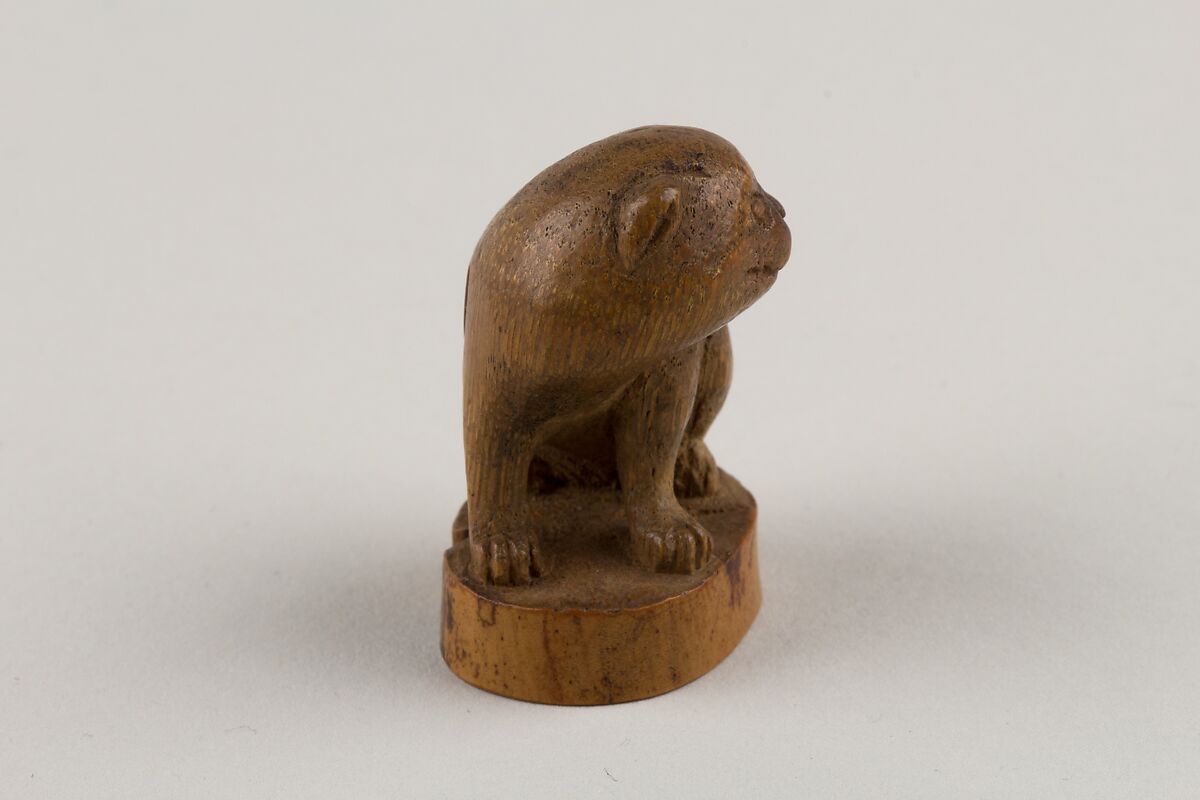 Netsuke: Seal in the Form of a Seated Pug-Dog, Bamboo root, Japan
