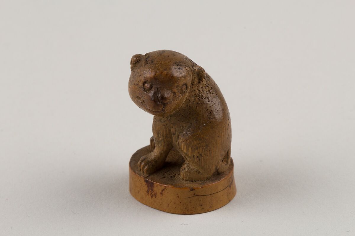 Netsuke: Seal in the Form of a Seated Pug-Dog, Bamboo root, Japan 