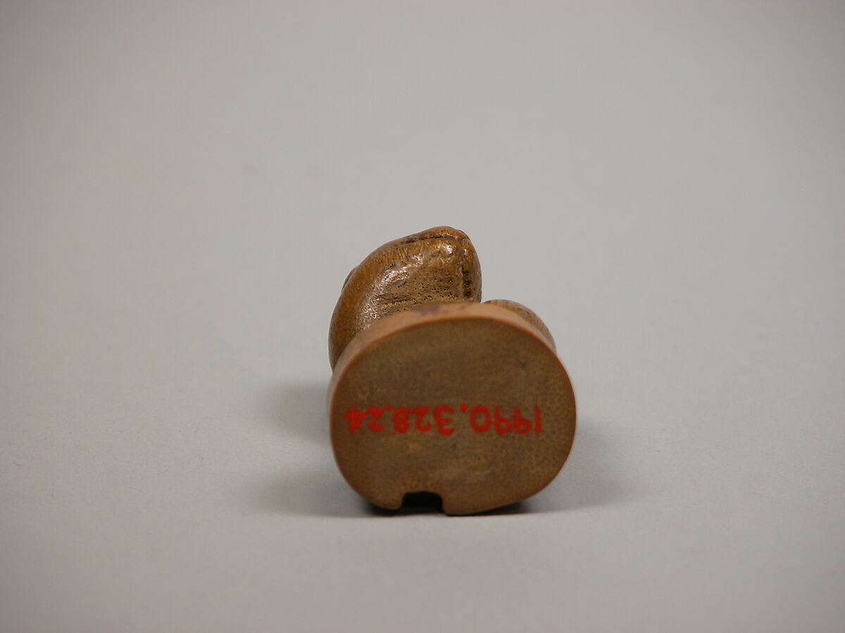 Netsuke: Seal in the Form of a Seated Pug-Dog, Bamboo root, Japan