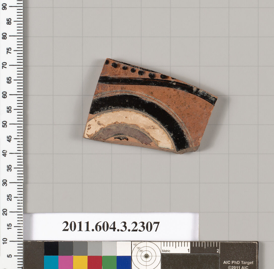 Terracotta fragment of a kylix: eye-cup (drinking cup), Terracotta, Greek, Attic 