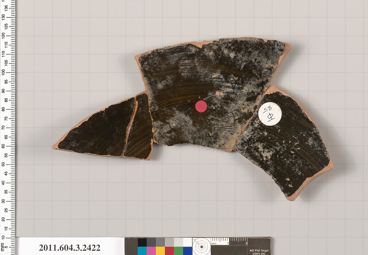 Terracotta fragment of a kylix: eye-cup (drinking cup), Terracotta, Greek, Attic