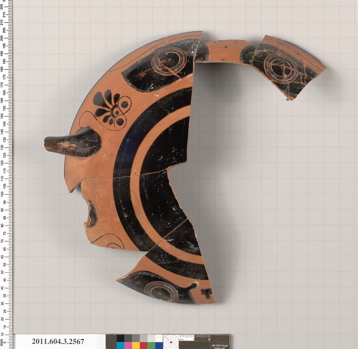 Terracotta fragment of a kylix: eye-cup (drinking cup), Terracotta, Greek, Attic
