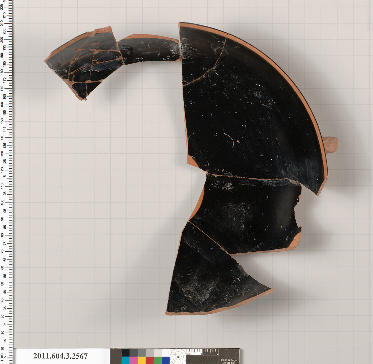 Terracotta fragment of a kylix: eye-cup (drinking cup), Terracotta, Greek, Attic 