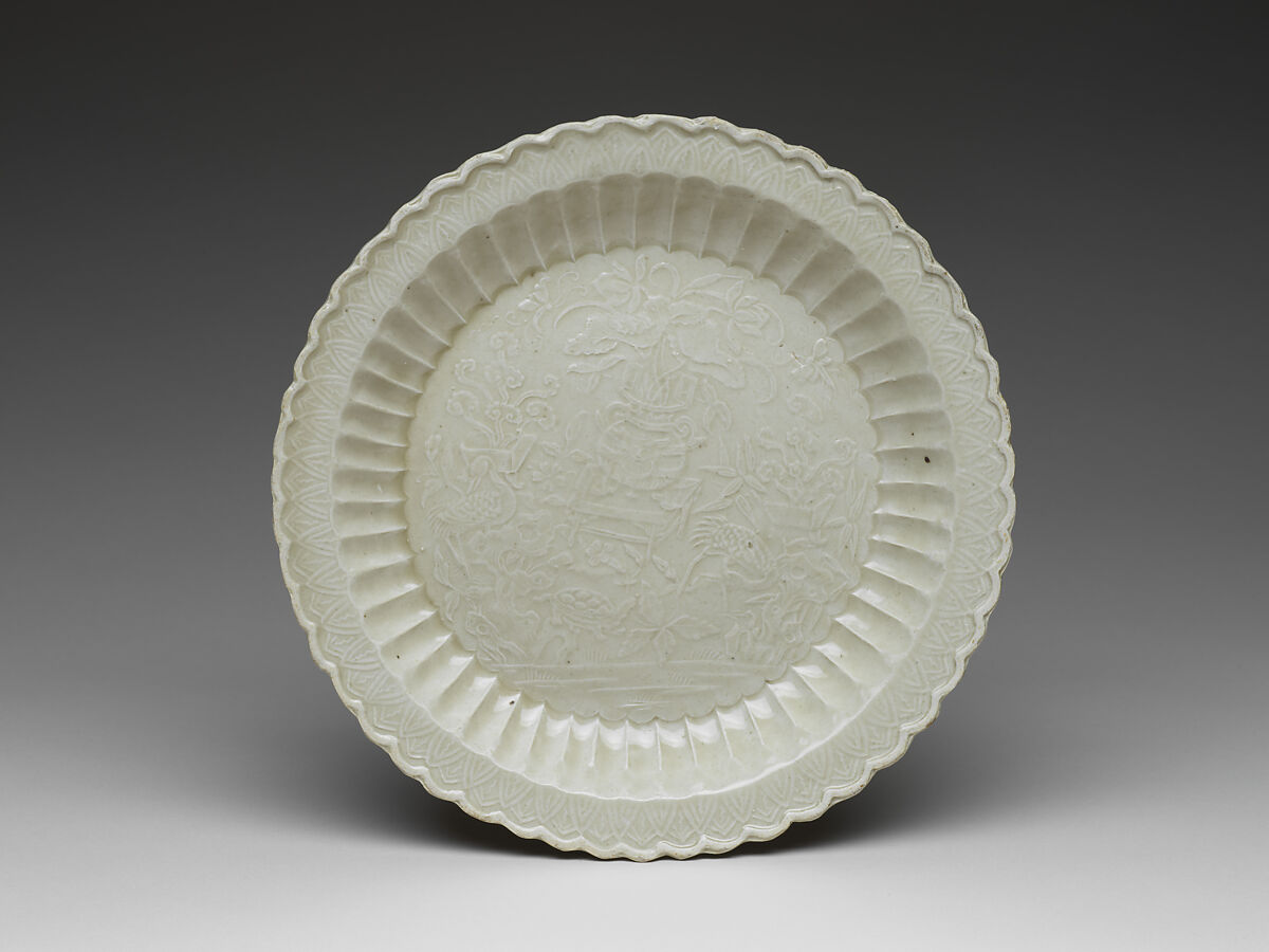 Chrysanthemum-petal dish with tortoise, cranes, and flowers, Porcelain with impressed design under glaze (Ding ware), China