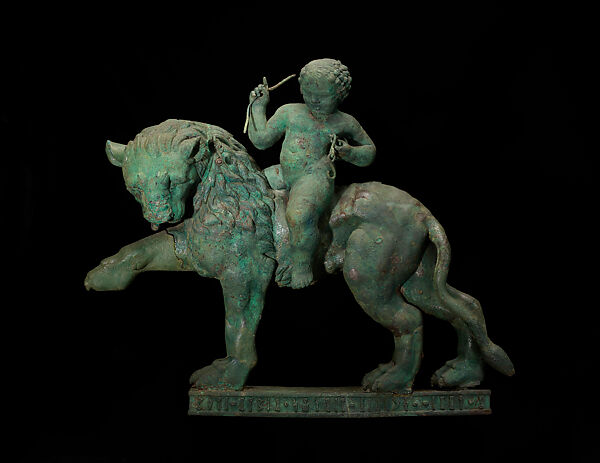 Striding lion ridden by Eros or child Dionysos, Bronze 