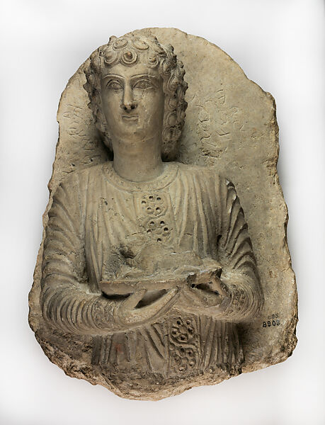 Relief with banquet attendant holding roasted lamb, Limestone 