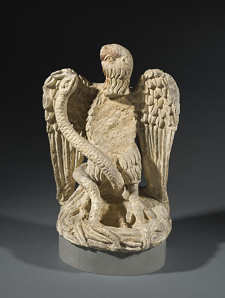 Sculpture of eagle fighting serpent, Limestone 