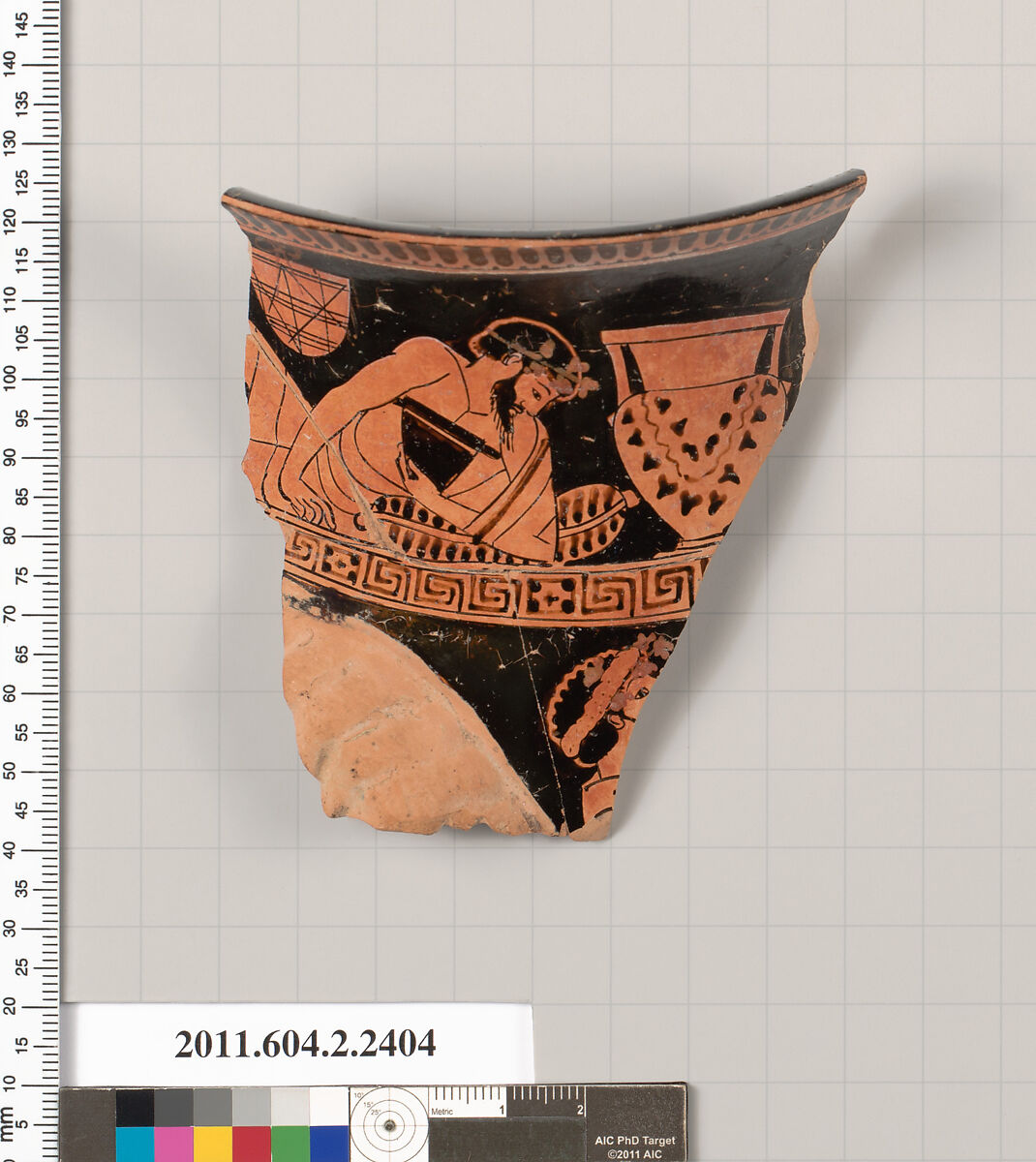 Terracotta fragment of a rhyton in shape of a ram's head (vase for libations or drinking), Terracotta, Greek, Attic 