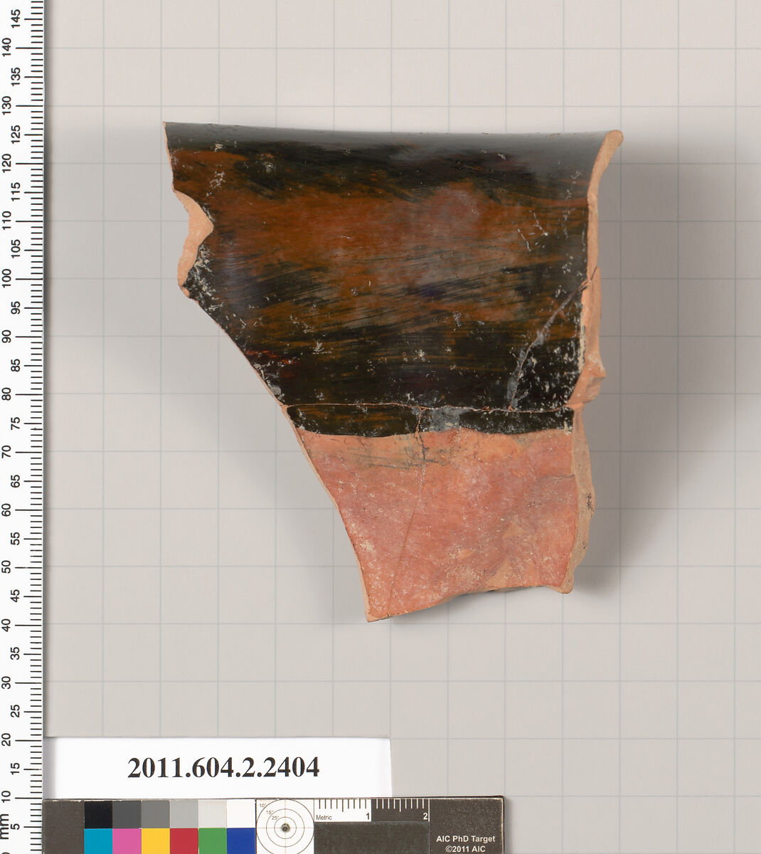 Terracotta fragment of a rhyton in shape of a ram's head (vase for libations or drinking), Terracotta, Greek, Attic